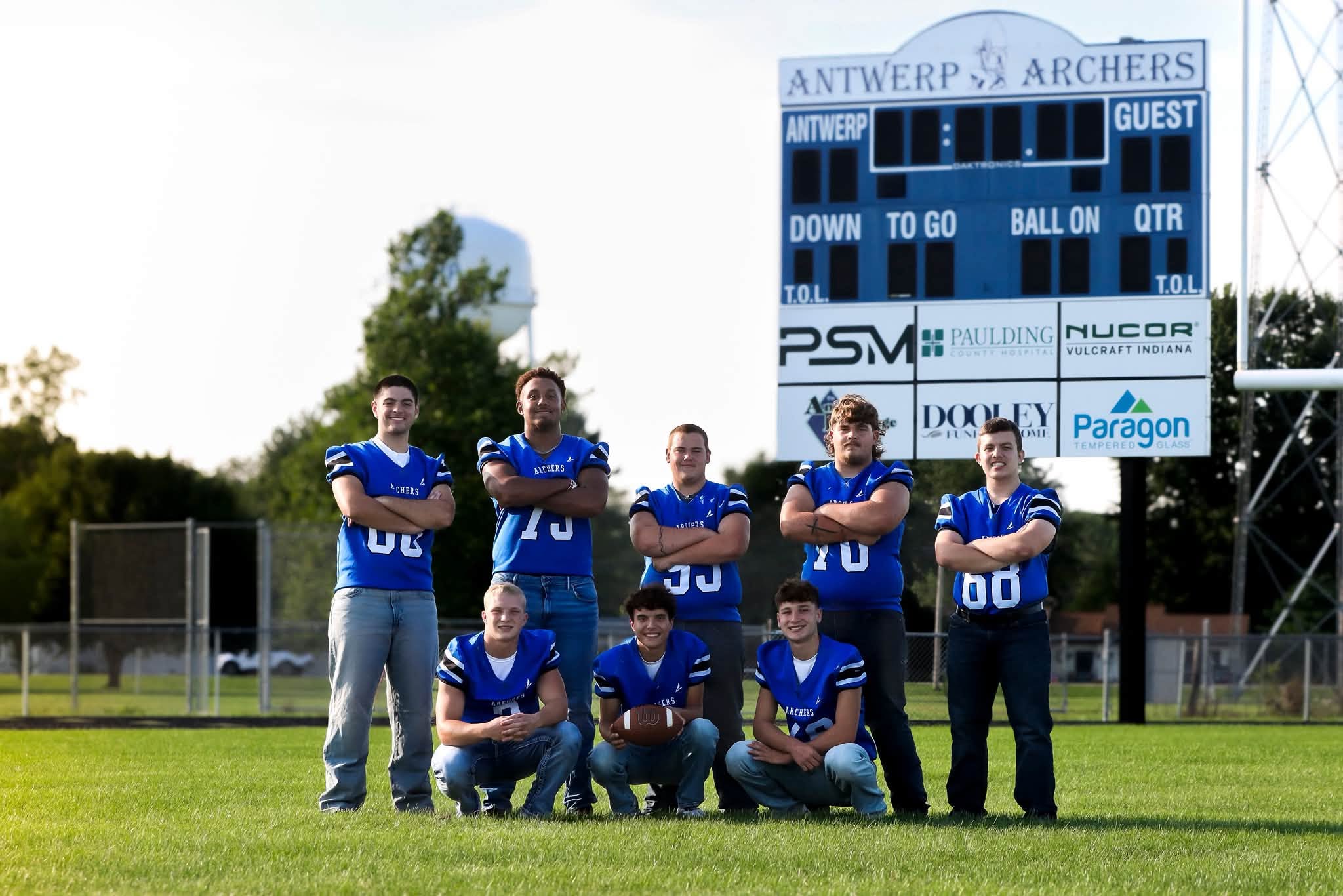Group at scoreboard